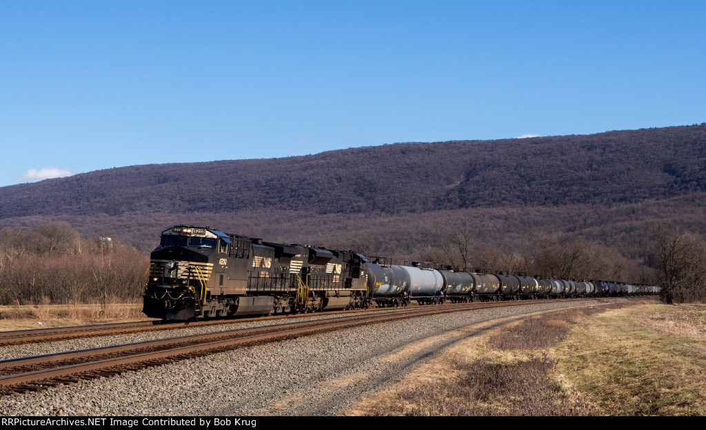 Tuscarora Mountain looms in the background as a long manifest freight glides around Mexico Curve